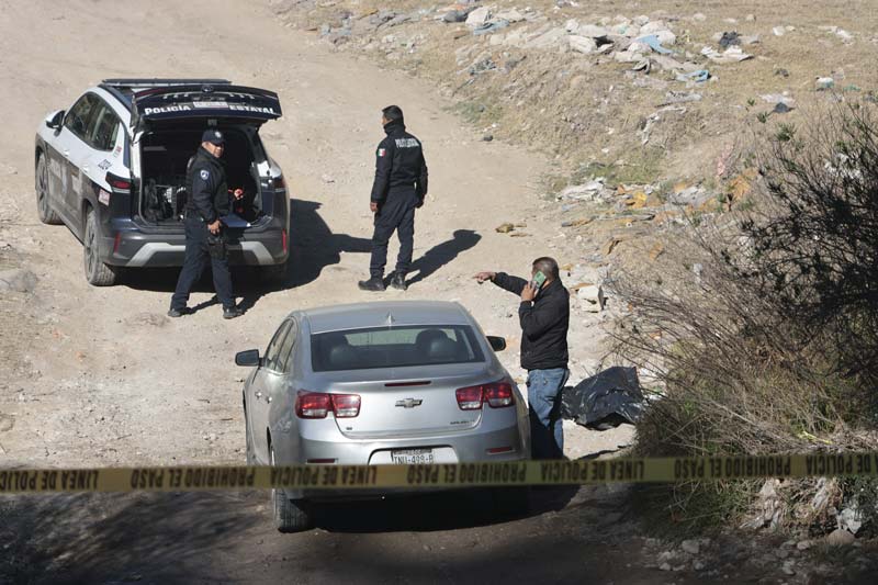 Hallan cuerpo embolsado con impacto de bala en Santa María Xonacatepec
