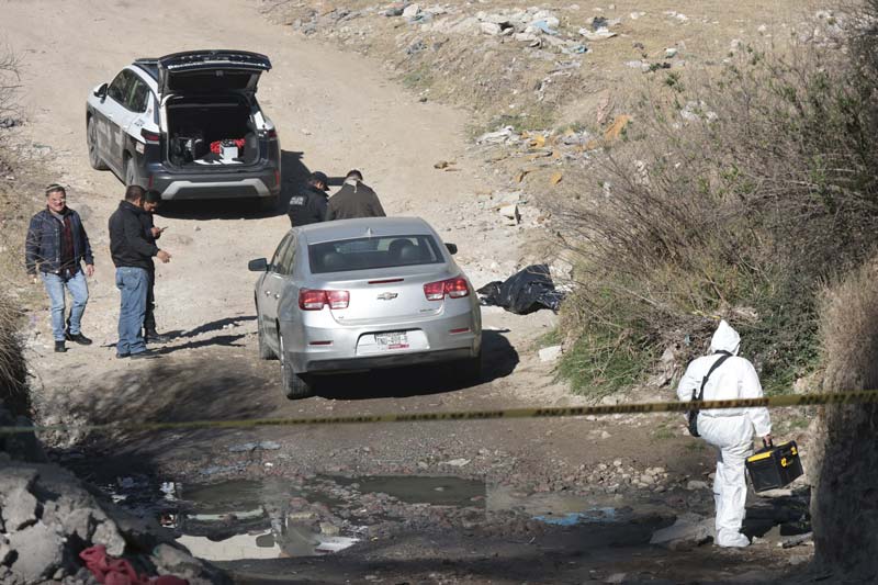 Hallan cuerpo embolsado con impacto de bala en Santa María Xonacatepec