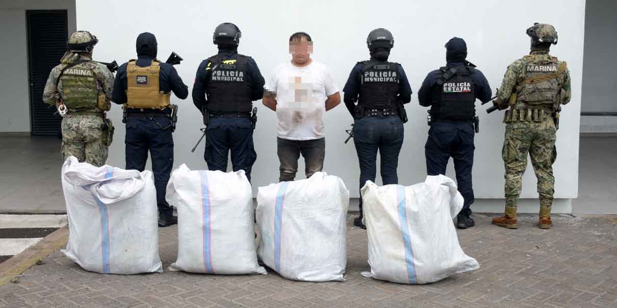 Detienen a hombre con cuatro costales llenos de marihuana en Totimehuacán