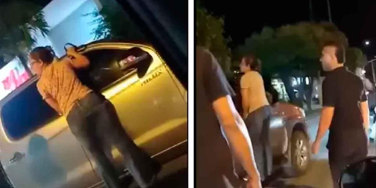 Mujer se colgó de una camioneta para bajar a la amante de su pareja