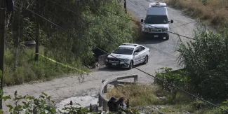 Hallan cuerpo atado y con disparo en Periférico Ecológico de Puebla