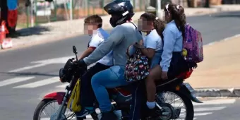 Mayor multa a motociclistas en la capital "si cargan" con toda la familia